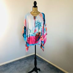 Jm Collection Women's Tropical-Print Poncho Sz 3x Nwt. Measures Approx. 29” In Length; Armpit To Armpit Approx. 33” Flat. Capture A Taste Of The Islands With This Tropical-Print Poncho From Jm Collection. Poncho Sleeves Scoop Neckline With Tie Closure Relaxed Fit; Hits At Hip Due To Generous Sizing, We Suggest Sizing Down For The Perfect Fit Polyester Machine Washable #Lisamariesvibe #Jmcollection #Resort #Resortwear #Tropical #Destination #Beach #Pool #Vacation #Cruise #Travel #Poncho #Palmtree Casual One Size Poncho For Vacation, Casual One-size Poncho For Vacation, Multicolor Oversized Casual Cover-up, Casual Oversized Multicolor Cover-up, One Size Multicolor Beach Tops, White Beach Tops With Kimono Sleeves, Oversized Multicolor Beach Top, Oversized Multicolor Tops For Beach, White Kimono Sleeve Top For Beach