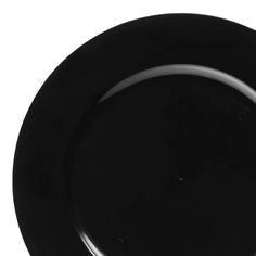 an empty black plate on a white background