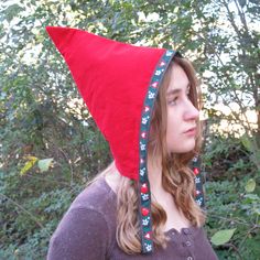 Introducing our whimsical and fun handmade pixie hats, the perfect accessory for adding a touch of magic to your winter wardrobe. These unique triangular-shaped hats are made of soft and warm red corduroy and lined with gingham check flannel for added warmth and comfort. Reversible and trimmed with playful woven jacquard ribbon ties, these hats are perfect for dress up and Pretend Play. The two sets of snaps at the chin ensure a secure fit, with no ties or bows to fuss with. Whether your child w Easy Gnome Costume, Adult Pixie Hat Sewing Pattern, Diy Gnome Hat Costume, How To Make A Gnome Hat, Cone Hat Diy, Gnome Costumes For Adults, Gnome Hat Patterns, Diy Gnome Hat, Diy Gnome Costume