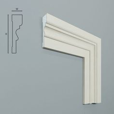 an image of a white window frame with measurements on the wall next to it,