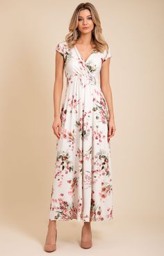 Welcome the new season with delicate blossoms and dusky pink and sage green tones. Our pink petal floral design is now available in our signature Sophia Maxi jersey dress. Cut with care to drape beautifully from empire line to full flowing skirt, our Sophia maxi is made from the softest jersey and features a cinched in waist and gathering around the bust for a flattering shape. Maxi dress in dusky pink blossom design over an oyster ground Soft, sumptuous and breathable viscose jersey Flattering Feminine Floral Maxi Dress For Garden Party, Elegant Rose Print Spring Maxi Dress, Elegant Rose Print Maxi Dress For Spring, Elegant Spring Maxi Dress With Rose Print, Flowy Rose Print Maxi Dress, Flowy Floral Print Maxi Dress With Empire Waist, Elegant Rose Print Maxi Dress For Garden Party, Feminine Floral Print Maxi Dress With Surplice Neckline, Floral Print Maxi Dress With Empire Waist