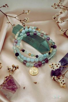 Wear this powerful Water element bracelets stack when you feel the need to connect with celestial energies of the universe and draw in peace, strength and calmness. This gemstone stretch bracelet trio of Aquamarine, Amazonite and Fluorite offers transmutive energy and harmonizes effortlessly, helping you adjust and adapt to natural flows of life. Water element charm, symbolizing balance, communication and aura cleansing, adds a soulful touch to this gorgeous bracelet stack. Water Element: Cool, Spiritual Stackable Healing Stretch Bracelet, Spiritual Stackable Bracelet For Healing, Spiritual Healing Stackable Stretch Bracelet, Fusion Style Healing Bracelets With Gemstone Beads, Mystical Healing Gemstone Beads Bracelets, Spiritual 8mm Beads Wrap Bracelet For Healing, Mystical Round Beads Bracelets For Meditation, Mystical Healing Gemstone Beads Bracelet, Spiritual Healing Stackable Beaded Bracelets