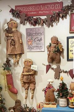 the gingerbread baking co display is filled with cookies, muffins and christmas decorations