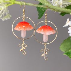 3D Magical red mushroom drop earrings - Cute mushroom leaf dangle earring - unique dangle  🤍 Hypoallergenic 🌸 Handmade with love ✨ Cute & Dainty 🎁 Gift ready 〰️Click👇🏻 Find more Earrings🎀 https://www.etsy.com/shop/byYeeSo ◽️ PACKAGING ◽️ * The jewelry will be nicely packaged * Comes with a drawstring suede pouch * If you need personalized gift note, please click the link below, add it to your cart when check out to upgrade your packaging. https://www.etsy.com/listing/1008661207/upgrade-gif Glass Mushroom Earrings, Cool Earrings Unique, Mushroom Clothing, Mushroom Earring, Mushroom Outfit, Earrings Mushroom, Earrings Cottagecore, Earring Unique, Cottagecore Earrings