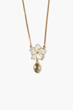 An understated beauty, this gold necklace features a glowing carved white mother of pearl flower pendant with labradorite marquise drop. 18k gold plated sterling silver, white mother of pearl, labradorite. 17" - 19" adjustable. Handmade in Vietnam.