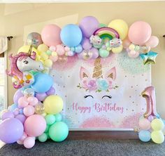 a unicorn themed birthday party with balloons and streamers