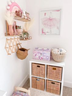 a white room with baskets and toys on the wall