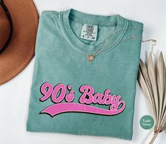 90s Baby Graphic Comfort Colors® Tee Shirt | 90s Shirts For Women | Retro Vintage 90s Graphic Baby Shirts | Shirts From The 90s | S74 CREATION TIME: 1-3 Business Days SHIPPING TIME: 2-5 Business Days MATERIALS: - COMFORT COLORS® SHIRTS Comfort Colors 1717 tee is made with medium fabric consisting of high quality, 100% ring-spun US cotton for long-lasting comfort. All Comfort Colors 1717 shirts feature pre-shrunk cotton for size retention and a signature sewn-in twill label. Made using 100% US co 90s Style Soft-washed Tops For Streetwear, 90s Soft-washed Tops For Streetwear, 90s Style Relaxed Fit Soft-washed Tops, 90s Style Soft-washed Relaxed Fit Tops, 90s Baby, 90s Shirts, Comfort Colors Tee, Baby Shirts, Shirts For Women