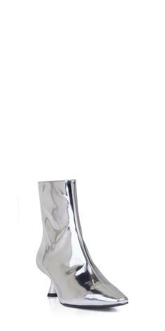 Upgrade your wardrobe with the sleek and stylish Simon Miller Kuki Ankle Boot. Made from metallic chrome silver leather, it features a classic pointed toe and sculptural kitten heel for a timeless yet modern look. Elevate any outfit with this must-have addition. Details: Color: Chrome 100% leather Heel height: 5cm/2in Boot shaft: 16cm Vendor Code: F171-9137 Zip closure Fits true to size; European sizing Modern Metallic Leather Heels, Sleek Silver Heels With Sculpted Heel, Silver Ankle Boots With Reinforced Heel, Metallic Silver Pointed Toe Formal Boots, Modern Metallic Heels In Metallic Leather, Elegant Silver Ankle Heeled Boots, Elegant Silver Ankle Boots, Sleek Low Heel Party Boots, Modern Metallic Heels