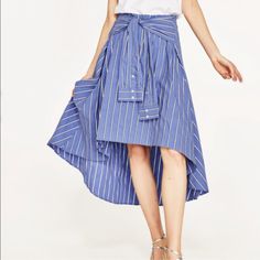 Zara Striped Midi Skirt 4886/083 Limited Edition Shirt-Style Midi Skirt With Sleeves Belt Details. Side Zip New With Tag Composition 72%Cotton 25%Polyamide 3%Elastane Approximate Measurement Laying Flat Waist 13” Front Length 22” Back Length 34” Bin 5 Summer Pleated Midi Wrap Skirt, Blue Midi-length Summer Bottoms, Blue Midi-length Bottoms For Summer, Striped Flared Skirt For Summer, Chic Blue Cotton Skirt, Chic Pleated Wrap Skirt For Spring, Striped Lined Skirt For Day Out, Chic Striped Midi-length Bottoms, Chic Striped Midi Length Bottoms