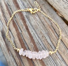 Genuine raw rose quartz bracelet in gold or silver. Dainty and delicate romantic and soft. Rose Quartz is the stone of universal love. It restores trust and harmony in relationships, encouraging unconditional love. Rose Quartz purifies and opens the heart at all levels to promote love, self-love, friendship, deep inner healing and feelings of peace. It draws in love, romance, and attraction. It sure is a feminine stone that works well for every women. Normal bracelet length is 7 inches. Options: Pink Crystal Bracelet With Stones As Gift, Normal Bracelet, Pink Gemstone Bracelet, Raw Stone Bracelet, Crystal Mobile, Raw Rose Quartz, Bracelet Heart, Rose Quartz Bracelet, Inner Healing