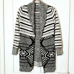 A Wonderful Duster Style Cardigan Sweater From The Urban Outfitters Ecote Line. Features An Open Front Style (No Buttons For Closure) With A Shawl Neck And A Varied Black And White Knit Pattern With Stripes And Other Designs. Has Lined Pockets At The Side. Never Worn. Only Flaw Is A Brown Spot On One Cuff That Appears To Be Miscolored Thread Rather Than A Stain (See Last Pic). Total Length Approx 30". Urban Outfitters Sweater For Winter Layering, Urban Outfitters White Outerwear For Fall, Fitted Winter Cardigan By Urban Outfitters, Fitted Urban Outfitters Cardigan For Fall, Urban Outfitters Fitted Winter Cardigan, Blue Striped Skirt, Soft Knit Cardigan, Slouchy Cardigan, Drop Shoulder Cardigan