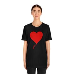 A simple minimalist gesture that tells you how much you are loved. We call this design 'One Heart Forvever' with it's adorable trail of tiny hearts leading to the onen solitary heart. Gift this adorable T-shirt to that special someone who is dear to your heart and watch them beam with pleasure. XS S M L XL 2XL 3XL Width, in 16.50 17.99 20.00 22.01 24.02 25.98 27.99 Length, in 27.01 27.99 29.02 30.00 31.02 32.01 32.99 Sleeve length, in 8.62 8.90 9.17 9.45 9.72 10.00 10.39 Black Top With Heart Graphic As Gift, Black T-shirt With Heart Graphic For Valentine's Day, Black T-shirt With Heart Graphic As Gift, Heart-shaped T-shirt For Valentine's Day, I Love Jesus, Jesus Tees, Love Jesus, You Are Loved, Tiny Heart