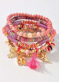 Add a touch of whimsy to your accessory game with our Beaded Charm & Shell Bracelet Set. Each bracelet features a unique assortment of colorful beads and charming puka shells. Perfect for those who like to mix and match for a playful and fun look. Bohemian Multicolor Stretch Bracelet For Vacation, Whimsical Pink Jewelry For Beach, Whimsical Pink Beach Jewelry, Bohemian Charm Bracelet For Beach, Bohemian Beaded Charm Bracelet For Beach, Beach Fun Jewelry With Heishi Beads, Bohemian Multicolor Charm Bracelet For Friendship, Multicolor Bohemian Charm Bracelet For Friendship, Bohemian Pink Beaded Bracelets For Vacation