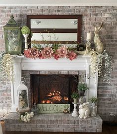 a fireplace decorated with flowers and candles