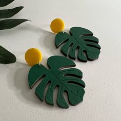 Hand-Painted Monstera Leaf Earrings Condition: Brand New! *These Earrings Are 100% Handmade * These Items Are Individually Made With Love By Me. Details: Handmade Item Materials: Wood & Plastic Hypo-Allergenic Stainless Steel Posts Includes Rubber Backs Length: 2.6” Style: Hippie/ Retro Care Instructions: Store Out Of Direct Sunlight And Keep Away From Water. It Is Not Recommended To Wear These Earrings In Or Around Water Hand Painted Yellow Earrings For Summer, Hand Painted Green Summer Earrings, Trendy Hand Painted Green Earrings, Trendy Green Hand-painted Earrings, Trendy Green Hand Painted Earrings, Handmade Yellow Fun Earrings, Fun Yellow Handmade Earrings, Artsy Yellow Earrings For Pierced Ears, Fun Hand Painted Yellow Earrings