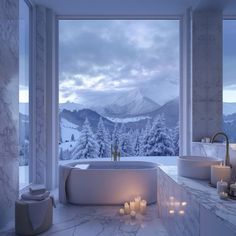 a bath room with a large window and a tub next to candles on the floor