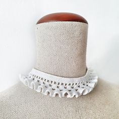 This Neck Ruff crochet choker necklace is made from 100% high-quality mercerized white cotton and tied with a white pearl button.  Choker length 35 cm / 13,8 inches, width - 3 cm / 1,2 inches. A simple yet elegant accessory that will work well with a lot of looks. The choker is similar to the Elizabethan ruffled lace collar. Teenagers, who prefer clothes in the Gothic style, also like to wear them to emphasize their individuality. The choker can be used as an additional accent for creating costu Crochet Neck Ruffle, Elegant Handmade Summer Choker, Handmade White Necklaces For Spring, Elegant White Choker For Summer, Elegant White Summer Choker, Handmade White Choker For Spring, Elegant White Crochet Necklace, Spring Gift White Choker, White Adjustable Choker Necklace