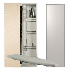 the ironing board is next to an open cabinet