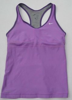 It says size M on it, but it fits smaller. Armpit to armpit: 15 inch, total length: 22 1/2 inch. Front panel: 92% polyester, 8% spandex. Back panel/Insets/bra front lining: 100% polyester. Bra back lining: 81% nylon, 19% spandex. Bra cup: 94% polyester, 6% spandex. Purple Sleeveless Moisture-wicking Top, Nike Sporty Sleeveless Vest, Fitted Cotton Sports Vest, Nike Sleeveless Sports Vest, Fitted Cotton Vest For Sports, Purple Sleeveless Gym Tops, Nike Casual Sleeveless Vest, Casual Nike Sleeveless Vest, Sporty Sleeveless Purple Top