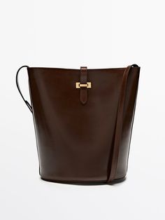 Find MASSIMO DUTTI Nappa Bucket Bag on Editorialist. This Massimo Dutti bucket bag is crafted from nappa leather and features a buckle closure. It measures 26 x 30 x 14 cm and can be worn on the shoulder or crossbody. Modern Formal Bag With Buckle Closure, Modern Formal Bag, Luxury Office Bags With Buckle Closure, Luxury Leather Bags With Buckle Closure, Formal Crossbody Bag With Buckle Closure, Luxury Bucket Shape Shoulder Bag For Work, Classic Calf Leather Bucket Bag For Business, Classic Leather Bag With Buckle Closure, Classic Leather Bags With Buckle Closure