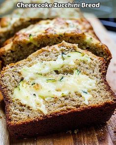 slices of zucchini bread on a cutting board with cheese and herbs in the middle