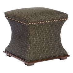 a foot stool made out of wood and fabric with an intricate pattern on the top