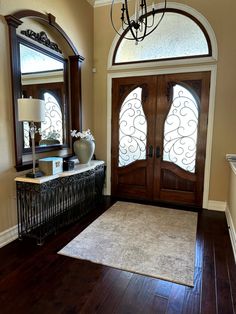 Paint colors to go with your dark wood trims, cabinets, floors, and furniture. Shown here is an early 2000s Tuscan style home with dark wood, dark wood double front door, transom window, dark wood floor and home decor.

#darkwood #update #diy #paintcolors #kyliem #sherwinwilliams #homeupdate Double Wood Front Doors, Door Transom, Sherwin Williams White