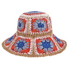 a red, white and blue crocheted hat with flowers on it's brim