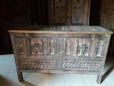 an old wooden chest sitting on top of a hard wood floor