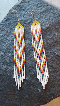 White and rainbow handmade beaded earrings. Aztec Earrings, Handmade Beaded Earrings, Beaded Fringe Earrings, Native American Earrings, Handmade Earrings Beaded, Spokane Wa, Beaded Jewelry Patterns, Beaded Fringe, Bead Jewelry