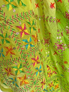 This elegant traditional Green Bridal Phulkari Dupatta is expertly crafted from Pure Chinon Silk, with Gotta Patti and phulkari hand embroidery all over. The perfect choice for weddings, sangeet, jaago, and chunni ceremonies. Material: Pure silk chinon Work: Silk thread phulkari handwork, all over gotta patti work Pattern: Floral Size: Full Size 2.5 meters Dispatched in 1-3 business days Product Note:​ This is a handcrafted product from artisans and producer groups and due to the nature of the p Unstitched Embroidered Choli In Pista Green, Unstitched Embroidered Pista Green Choli, Unstitched Pista Green Embroidered Choli, Embroidered Green Choli For Festivals, Green Raw Silk Embroidered Fabric For Navratri, Green Embroidered Raw Silk Fabric For Navratri, Green Art Silk Embroidered Fabric For Navratri, Traditional Green Embroidered Lehenga, Bohemian Pista Green Salwar Kameez With Resham Embroidery