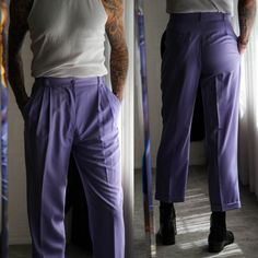 "FREE DOMESTIC SHIPPING These unbelievable vintage 90s 1992 collection Gianni Versace lilac wool gabardine triple pleated tapered cuffed leg slacks are a shop favorite! Rare pants with all the incredible stylings of the true early 90s Gianni Versace design. Amazing high waisted fit that drapes beautifully falling to a soft tapered cuffed leg. Excellent slacks to dress up or down. Made in Italy. Please refer to measurements below. <> Designer: Gianni Versace <> Made in Italy <> Fabric: 100% Wool  <> Size: Please refer to measurements. ( model stands 6'3\" tall ) <> Measurements: laying flat from left to right      waist: 15.75\" - 16\" ( 31.5\" - 32\" around with 1.5\" to let out )      front rise: 13\"      hips: 24\" ( 48\" around )      inseam: 29\" ( with 2\" for extra length )      bot Purple Tapered Leg Bottoms For Spring, Lavender Straight Leg Bottoms With Pockets, Purple Tapered Leg Pants With Pockets, Purple Tapered Leg Bottoms With Pockets, Fitted Purple Tapered Leg Pants, Fitted Purple Bottoms With Belt Loops, Fitted Purple Tapered Leg Bottoms, Lavender Straight-leg Pants With Pockets, Lavender Straight Leg Pants With Pockets