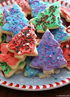 decorated christmas tree cookies on a plate