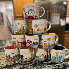 a stack of coffee mugs sitting on top of a counter