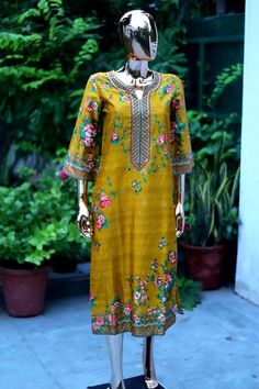 Description: Make an amazing statement this festive season by donning this stunning mustard floral printed kurta and mask set . Crafted in cotton, the kurta features a round neck, 3/4th sleeves and makes for an elegant pick to don for traditional events and occasions. Style this kurta with a pair of wide-leg bottoms and high heels to complete the look. Contains : one kurta and one mask  Product Details: Material Cotton Pattern Floral Type of Work Printed Occasion Party Size & Fit Fit Round Neck Designer Yellow Kurta With Printed Motifs, Designer Wear Yellow Kurta With Printed Motifs, Bohemian Cotton Silk Kurta For Eid, Yellow Traditional Wear Straight Kurta With Printed Motifs, Yellow Straight Kurta With Printed Motifs, Yellow Kurta With Printed Motifs, Yellow Traditional Wear With Printed Motifs, Straight Kurta, Festive Mustard Kurta With Resham Embroidery, Festive Mustard Straight Kurta