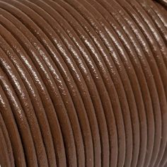 a close up view of a brown leather cord