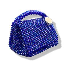 Artisanal Bead Bag.Designed in NYC. Crafted with precision in the heart of Lagos, Nigeria.Immerse yourself in the epitome of style with our exquisite beaded handbags – a timeless fusion of sophistication and versatility. Handcrafted with precision, these bags are designed to endure. Whether paired with a cocktail dress, casual denim and tee, professional attire, or your favorite clubwear, our bead bags effortlessly enhance any ensemble. Blue Shoulder Bag With Round Handle For Evening, Luxury Beaded Handheld Evening Bag, Luxury Handheld Beaded Evening Bag, Formal Beaded Shoulder Bag With Top Handle, Formal Beaded Top Handle Shoulder Bag, Evening Top Handle Bag With Beaded Details, Beaded Top Handle Evening Bag, Luxury Beaded Top Handle Evening Bag, Luxury Handheld Beaded Shoulder Bag