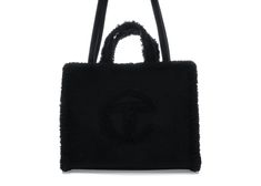 Designer Black Bags For Winter, Luxury Black Shoulder Bag For Winter, Luxury Winter Shoulder Bag For Shopping, Designer Evening Bags For Winter, Luxury Bags With Faux Fur Lining For Winter, Designer Bags For Everyday Use In Winter, Luxury Tote Bag For Winter, Designer Leather Bags For Winter, Ugg Telfar Bag