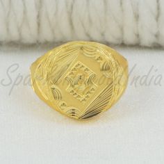 Inspired by the timeless beauty of traditional Indian artistry, this 22k gold ring embodies grace and sophistication. Handcrafted with intricate detailing, the design showcases a blend of classic motifs and contemporary flair. Perfect for marking special occasions or adding a touch of luxury to your everyday look, this ring celebrates the richness of Indian heritage with every gleaming curve. 22k gold ring handmade jewelry made in India Metal is Real Gold Not Filled or Not Gold Plated Metal - Ye Intricate Design Engraved Yellow Gold Ring Gift, Gift Yellow Gold Engraved Ring With Intricate Design, Intricate Engraved Yellow Gold Ring As Gift, Gift Intricate Engraved Yellow Gold Ring, Yellow Gold Temple Jewelry Rings For Formal Events, Formal Yellow Gold Temple Jewelry Rings, 22k Gold Filigree Ring For Gifts, 22k Gold Engraved Rings For Ceremonial Occasions, Engraved 22k Gold Rings For Ceremonial Occasions