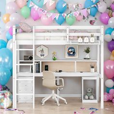 a room filled with balloons and a desk in front of a white bunk bed topped with a computer