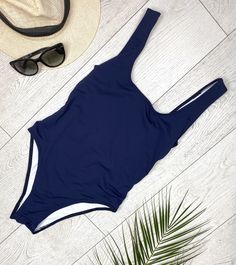 "FREE SHIPPING TO USA FOR ALL ORDERS OVER 35$! Choose right size by following our size chart below, thank you! We use FEDEX PRIORITY shipping service to the United States to guarantee the fastest delivery in 3-4 days. One piece swimsuit in dark blue fabric. Round neckline, shoulder straps, open back, high cut and lining at crotch. Stretchy and body fitting material. COLOR: DARK BLUE MEASUREMENTS: X-Small - Bust - 31\" - 32\" / 80 - 80 cm - Hips - 32\" - 34\" / 82 - 86 cm - Waist - 22\" - 23,5\"/ Fitted Solid One-piece For Beach Season, Fitted Solid One Pieces For Beach Season, Fitted One Pieces For Beach Season, Navy One-piece Swimwear, Navy Sleeveless Fitted Swimwear, Fitted Navy Swimwear For Sunbathing, Navy Fitted Swimwear For Sunbathing, Navy One-piece Swimwear For Beach Season, Fitted Navy Swimwear For Beach Season