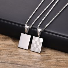 Stainless Steel Checkered Rectangular Tag Pendant Necklace for Men - Elevate Your Style with Chess-Inspired Elegance Description: Add a touch of sophistication to your ensemble with our Checkered Rectangular Pendant Necklace for Men. Crafted from durable stainless steel, this necklace features a stylish checkered design in gold, silver, or black color options, reminiscent of a classic chessboard. Perfect for layering or wearing solo, this trendy necklace is sure to make a statement at any occasion. Specifications: Occasion: Party Compatibility: All Compatible Pendant Size: 15mm*20mm Shape/Pattern: Round Model Number: NC-913GMP Material: Metal Chain Type: Link Chain Style: TRENDY Necklace Type: Pendant Necklaces Gender: Men Metals Type: Stainless Steel Fine or Fashion: Fashion Item Type: Ne Color Checker, Necklace Men, Necklace Chain Lengths, Trendy Necklaces, Mens Pendant, Men Model, Geometric Pendant, Metal Necklaces, Round Pendant