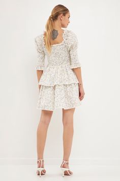 Delicate and dainty. That's what you'll feel like in our Lace Trim Floral Print Smocked Sleeve Mini Dress. With a floral print, lace trim, smocked bodice, and tiered ruffles, this dress is perfect for your next special event. And the best part? You'll feel like a fairytale princess while wearing it. Trust us, you'll want to twirl the night away in this gorgeous dress. Floral print Lace trim Smocked bodice Smocked sleeves Mini length Tiered ruffles Lining Hand wash cold Do not bleach Do not tumbl Spring Smocked Dress With Lace Trim, Daywear Floral Print Smocked Mini Dress, White Smocked Dress With Floral Print And Square Neck, White Smocked Square Neck Top With Ruched Detail, White Smocked Ruched Top With Square Neck, Fitted Smocked Top With Floral Print For Daywear, White Smocked Top With Ruched Square Neck, Fitted Smocked Dress With Ditsy Floral Print For Daywear, White Smocked Top For Brunch