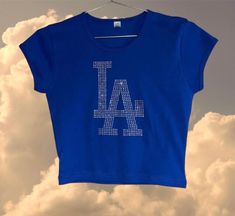 LA Los Angeles baseball inspired rhinestone design on  royal   CAP SLEEVE BABY RIB CROP TOP Los Angeles apparel t shirt  Made in Los Angeles Rhinestone Crew Neck Tops For Streetwear, Crew Neck Rhinestone Tops For Streetwear, Streetwear Crew Neck Tops With Rhinestones, Crew Neck Tops With Rhinestones For Streetwear, Casual Stretch Tops With Rhinestones, Vivienne Westwood T Shirt, Rib Crop Top, Los Angeles Apparel, Baseball Tee Shirts