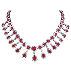 Sumptuous Burma rubies and vibrant white diamonds come together in this sensational antique necklace. Featuring a remarkable red hue, the Burma rubies total approximately 50 carats, while the diamonds that encircle them weigh a combined 30 carats. Hand-crafted in a fabulous gold-over-silver setting, such spectacular Victorian-era works of jeweled art make a perfect and timeless addition to any jewelry collection. Circa 1880 16" length Ruby Diamond Necklace, Ruby And Diamond Necklace, Pearl Drop Necklace, Diamond Necklace Set, Ruby Necklace, Gold Diamond Necklace, Expensive Jewelry, Antique Necklace, Ruby Jewelry