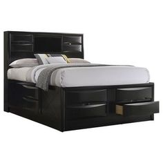 a black bed with drawers underneath it