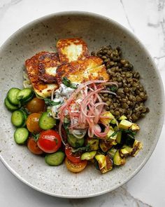 a white bowl filled with different types of food