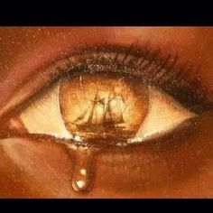 an eye with the image of a ship in it's irise and drops of water