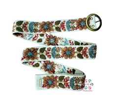 You will LOVE this belt, it perfectly matches with jeans, and the wool used to embroider this item is the natural color of sheep. Belts are inspired by the flowers of the Peruvian Andes. Handmade embroidered by women from Ayacucho - Peru The strap is handwoven in wood looms and carefully hand-embroidered with colors that try to replicate the beauty of real flowers we see around us. We decided to be eco-friendly, so we use 100% sheep wool. Material: 100% sheep wool. Design: artistic floral. Width Bohemian Embroidered Belt For Spring, Bohemian Brown Fabric Belt, Adjustable Folk Embroidered Belt, Folk Style Adjustable Embroidered Belt, Handmade Bohemian Belt With Multicolor Embroidery, Adjustable Beige Embroidered Belt, Beige Adjustable Embroidered Belt, Wool Design, Embroidered Belt